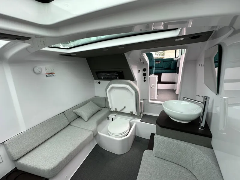 Slide: The Image of 2023 Axopar 37 XC Crosscabin interior with seating, toilet, and sink. - 6