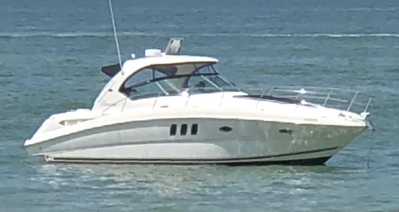 Slide: The Image of 2008 Sea Ray 38 Sundancer yacht on calm water. - 0