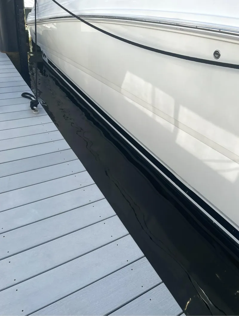 Slide: The Image of 2008 Sea Ray 38 Sundancer yacht docked beside a wooden pier. - 11