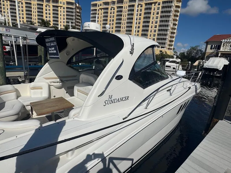 Slide: The Image of 2008 Sea Ray 38 Sundancer yacht docked at marina with luxury seating. - 12