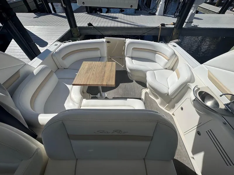 Slide: The Image of 2008 Sea Ray 38 Sundancer yacht with spacious seating and wooden table on deck. - 15