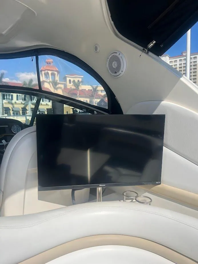 Slide: The Image of Interior of a 2008 Sea Ray 38 Sundancer yacht with a mounted TV screen. - 18