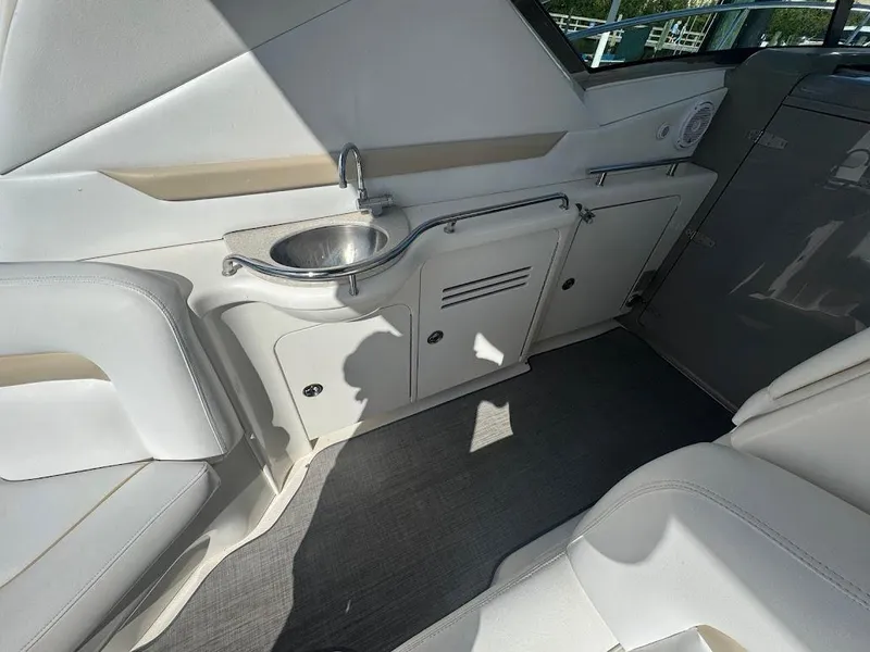 Slide: The Image of 2008 Sea Ray 38 Sundancer interior with sink and seating area. - 19