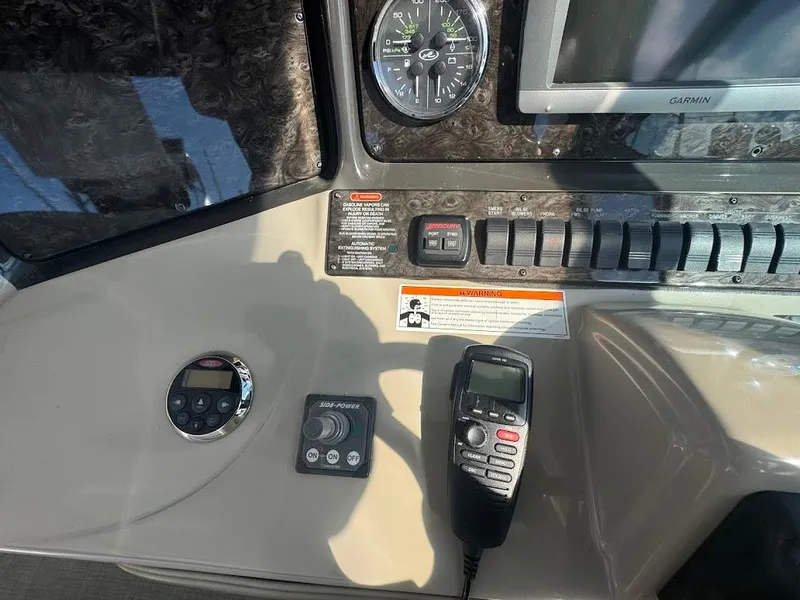 Slide: The Image of Control panel of a 2008 Sea Ray 38 Sundancer boat with navigation instruments. - 23
