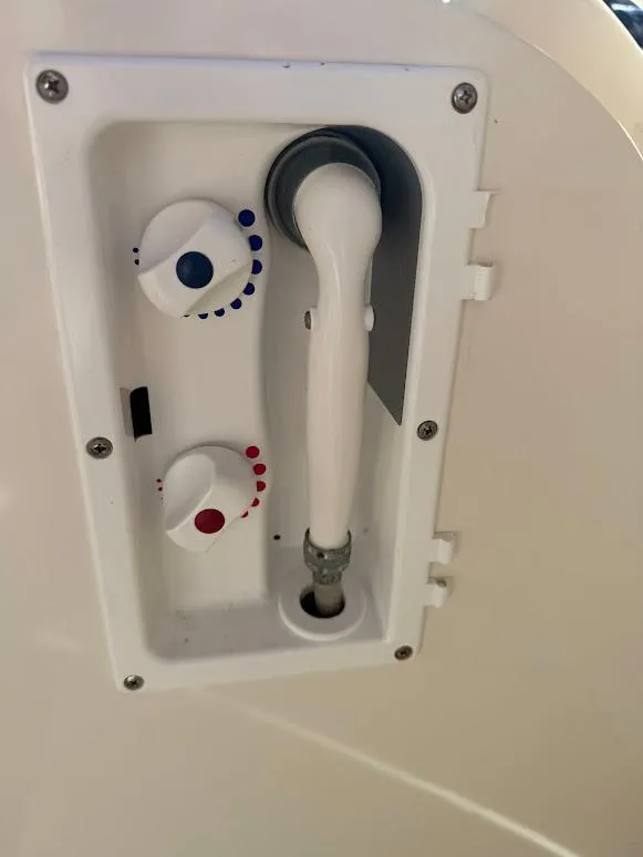 Slide: The Image of 2008 Sea Ray 38 Sundancer shower controls with adjustable temperature knobs. - 29