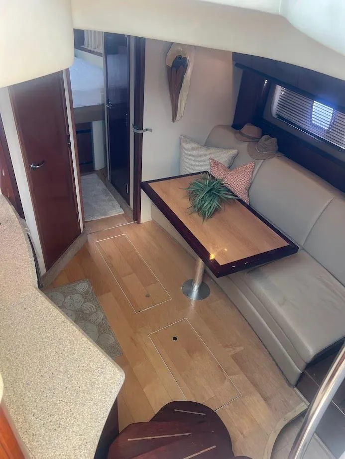 Slide: The Image of 2008 Sea Ray 38 Sundancer interior with dining area and modern decor. - 30