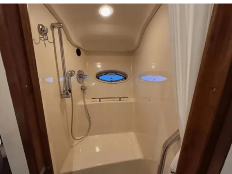 Slide: The Image of Shower area in 2008 Sea Ray 38 Sundancer yacht with porthole window. - 37