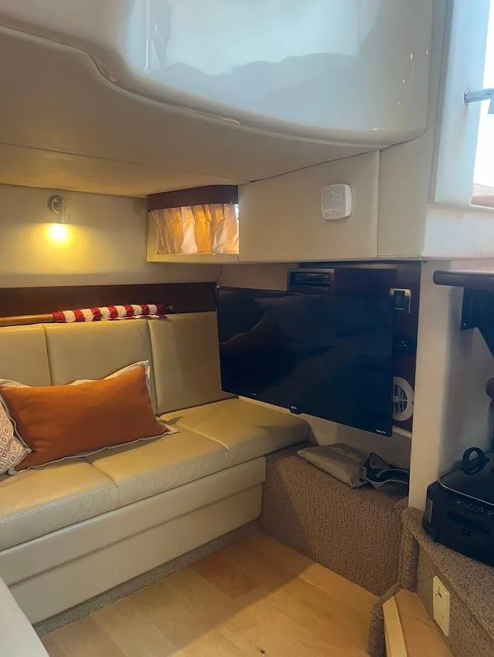 Slide: The Image of Interior of 2008 Sea Ray 38 Sundancer yacht with cozy seating and modern amenities. - 39