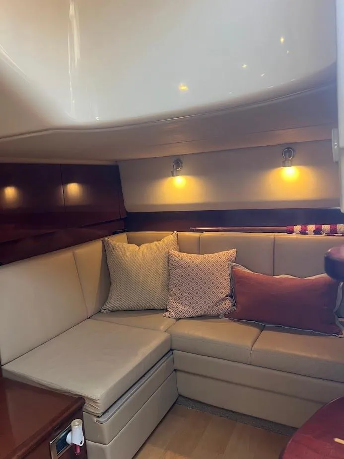 Slide: The Image of Interior of 2008 Sea Ray 38 Sundancer with cozy seating and ambient lighting. - 40