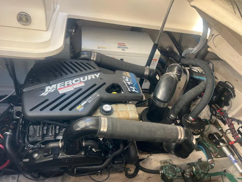 Slide: The Image of Engine compartment of a 2008 Sea Ray 38 Sundancer with Mercury engine components. - 46