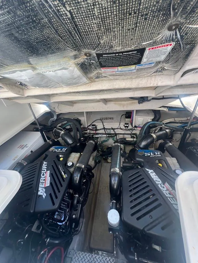 Slide: The Image of Engine room of 2008 Sea Ray 38 Sundancer with twin Mercury engines. - 47