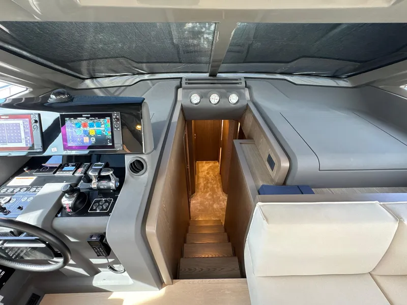 Slide: The Image of Helm station of 2022 Ferretti Yachts 550 with modern navigation equipment. - 12