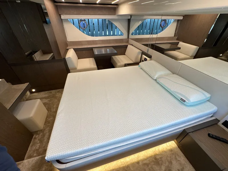 Slide: The Image of Luxurious interior of 2022 Ferretti Yachts 550 with modern bedroom and seating area. - 20