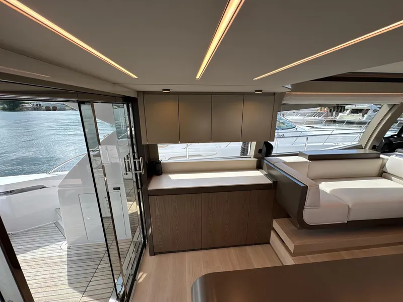 Slide: The Image of Luxurious interior of 2022 Ferretti Yachts 550, featuring modern design and waterfront view. - 3