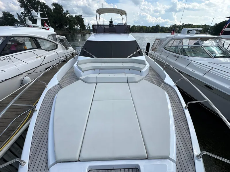 Slide: The Image of 2022 Ferretti Yachts 550 docked, showcasing spacious deck and sleek design. - 33