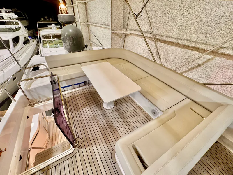 Slide: The Image of Luxurious seating area on 2022 Ferretti Yachts 550, featuring elegant design and spacious layout. - 68