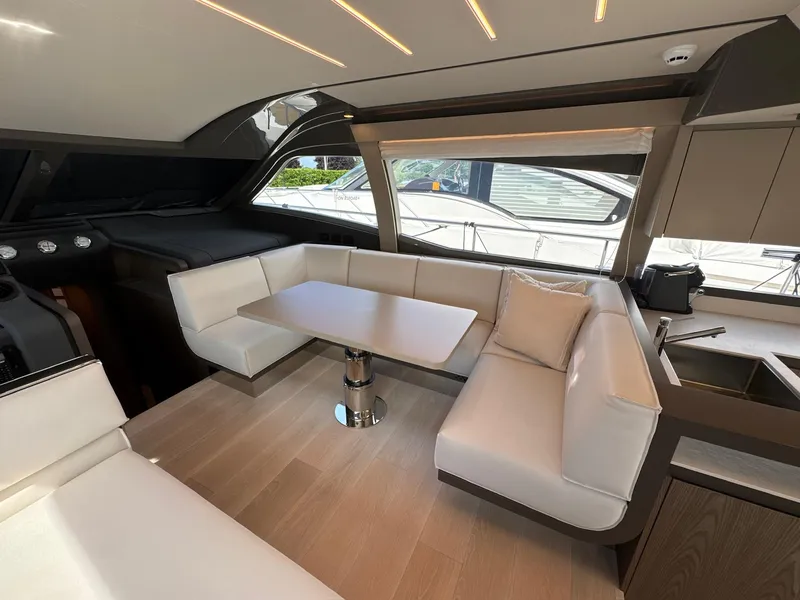Slide: The Image of Luxurious interior of 2022 Ferretti Yachts 550 with elegant seating and modern design. - 7