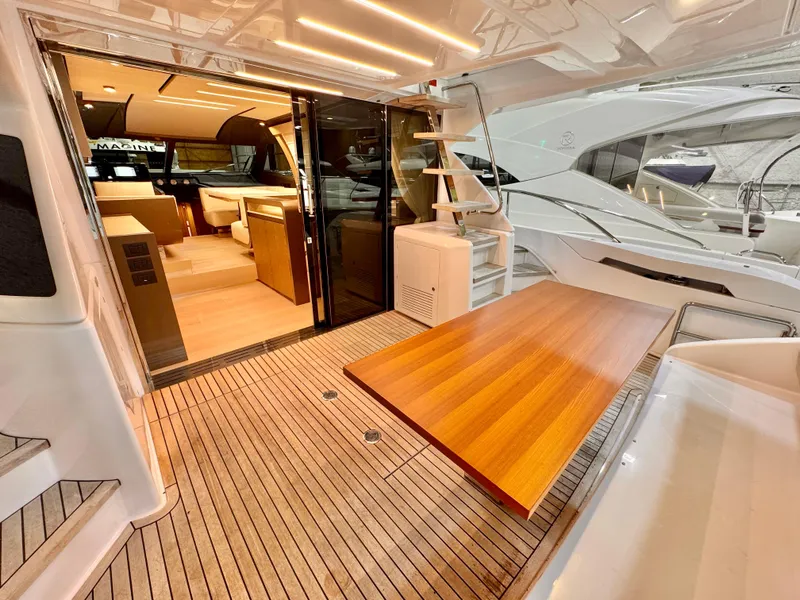 Slide: The Image of Luxurious 2022 Ferretti Yachts 550 interior with elegant wood finishes and modern design. - 79