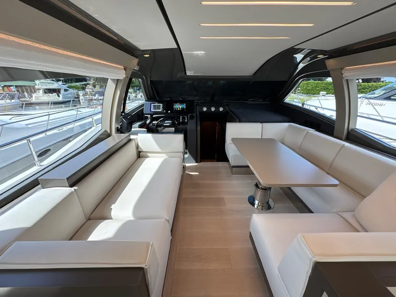 Slide: The Image of Luxurious interior of 2022 Ferretti Yachts 550 with elegant seating and modern design. - 8