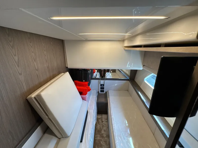 Slide: The Image of Interior of 2022 Ferretti Yachts 550, featuring modern seating and sleek design elements. - 15
