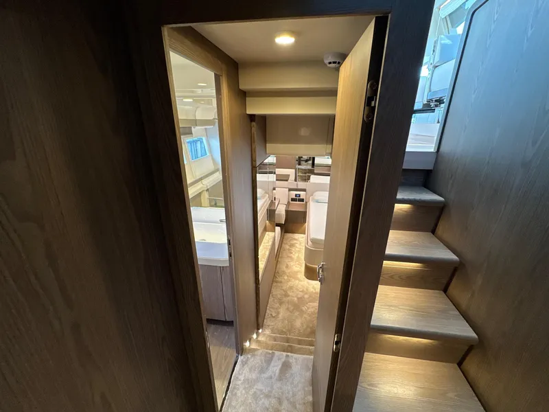 Slide: The Image of Luxurious interior of 2022 Ferretti Yachts 550, featuring modern design and elegant wood finishes. - 16