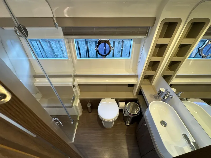 Slide: The Image of Luxurious bathroom in 2022 Ferretti Yachts 550, featuring modern fixtures and elegant design. - 17