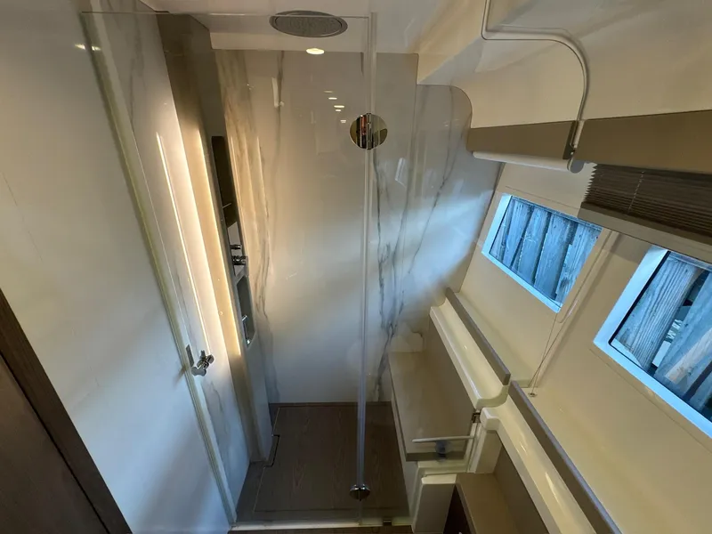 Slide: The Image of Luxurious bathroom interior of 2022 Ferretti Yachts 550 with modern design and natural lighting. - 18