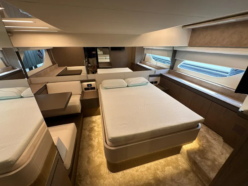 Slide: The Image of Luxurious bedroom interior of 2022 Ferretti Yachts 550 with modern design and ambient lighting. - 19