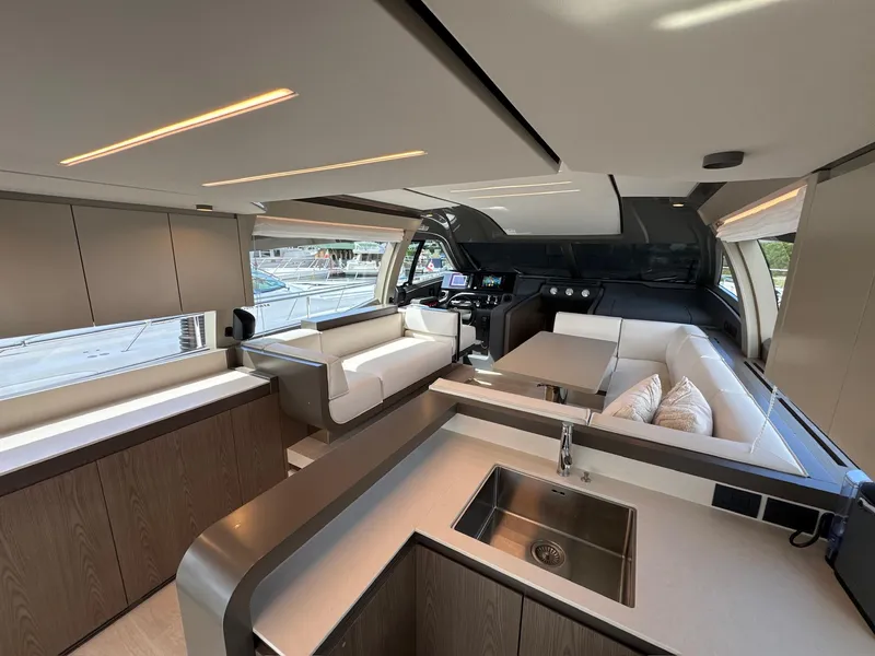 Slide: The Image of Luxurious interior of 2022 Ferretti Yachts 550, featuring modern design and spacious seating. - 2