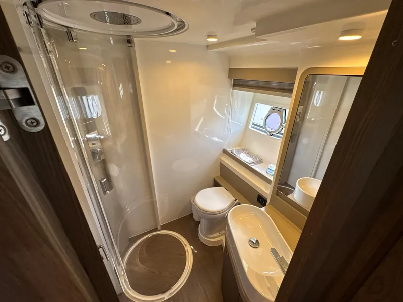 Slide: The Image of Luxurious bathroom in 2022 Ferretti Yachts 550, featuring modern fixtures and elegant design. - 24