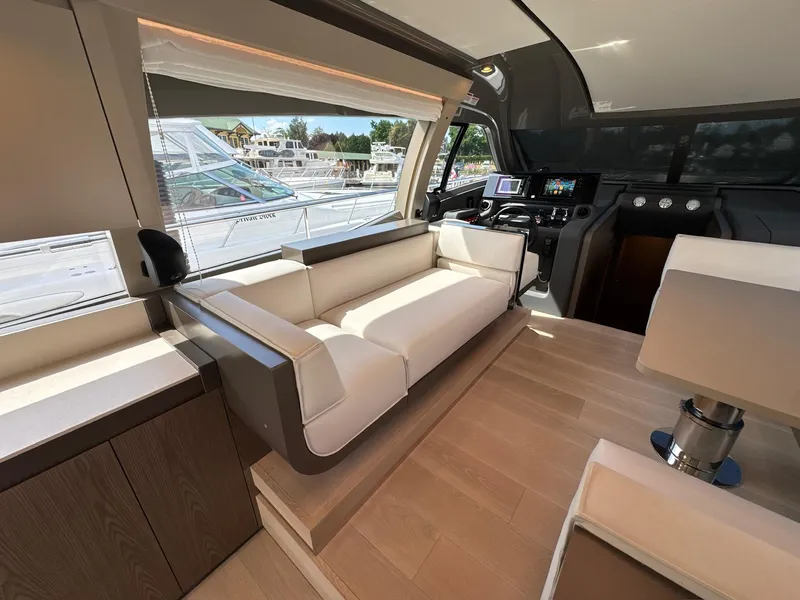 Slide: The Image of Luxurious interior of 2022 Ferretti Yachts 550, featuring elegant seating and modern navigation controls. - 5