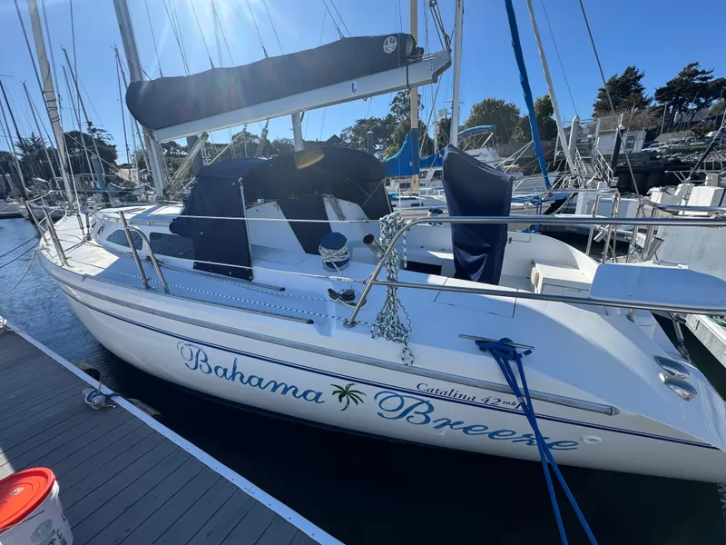 The Image of 2001 Catalina 42 MK II sailboat named "Bahama Breeze" docked at a marina. - 0