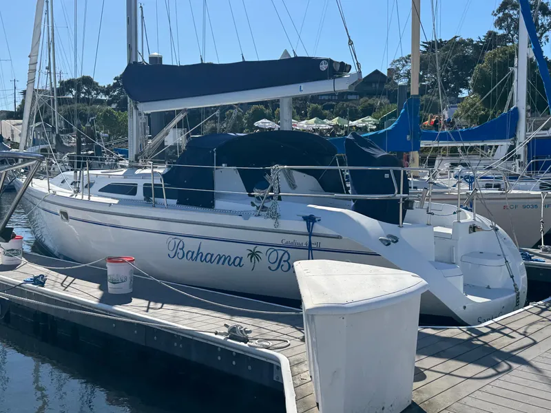 Slide: The Image of Catalina 42 MK II sailboat docked, 2001 model, named "Bahama Breeze." - 1