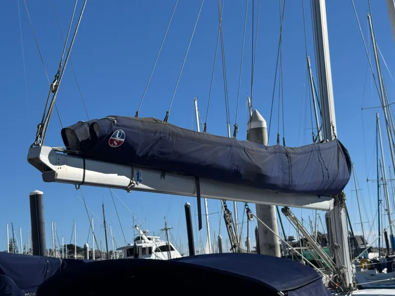 Slide: The Image of 2001 Catalina 42 MK II sailboat mast and boom covered at marina. - 10