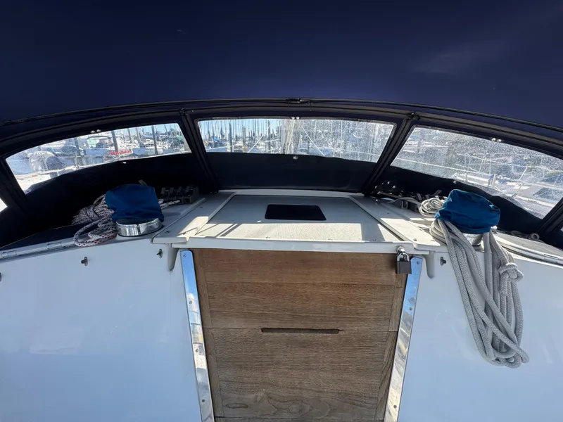 Slide: The Image of 2001 Catalina 42 MK II yacht cockpit with ropes and wooden hatch. - 11
