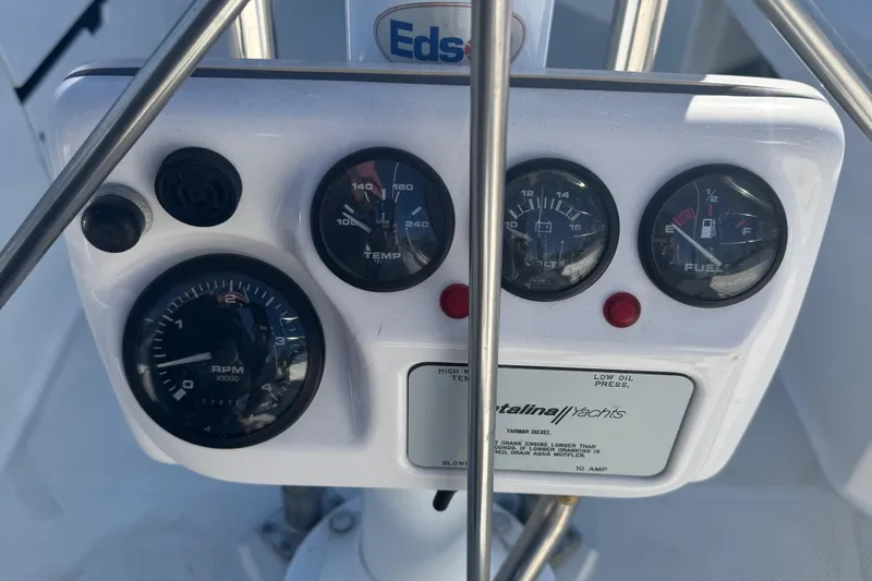 Slide: The Image of Instrument panel of a 2001 Catalina 42 MK II yacht, featuring gauges and controls. - 13