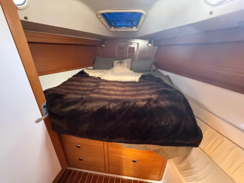 Slide: The Image of Cozy cabin interior of 2001 Catalina 42 MK II sailboat with plush bedding. - 17