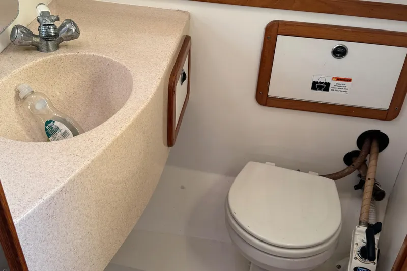 Slide: The Image of Compact bathroom in 2001 Catalina 42 MK II sailboat with sink and toilet. - 19