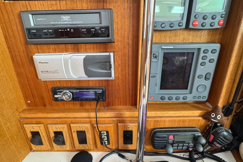 Slide: The Image of Control panel of a 2001 Catalina 42 MK II sailboat with navigation and communication equipment. - 20