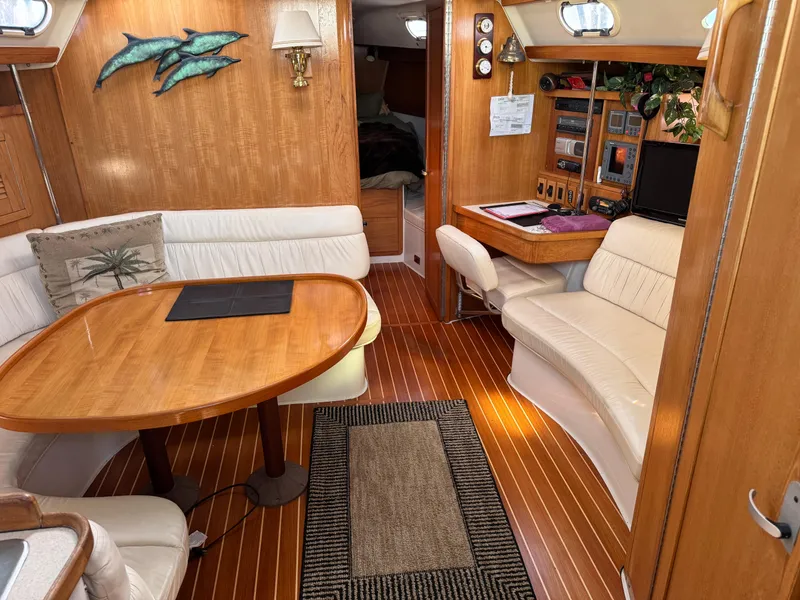 Slide: The Image of Interior of 2001 Catalina 42 MK II sailboat with wood finish and cozy seating area. - 21