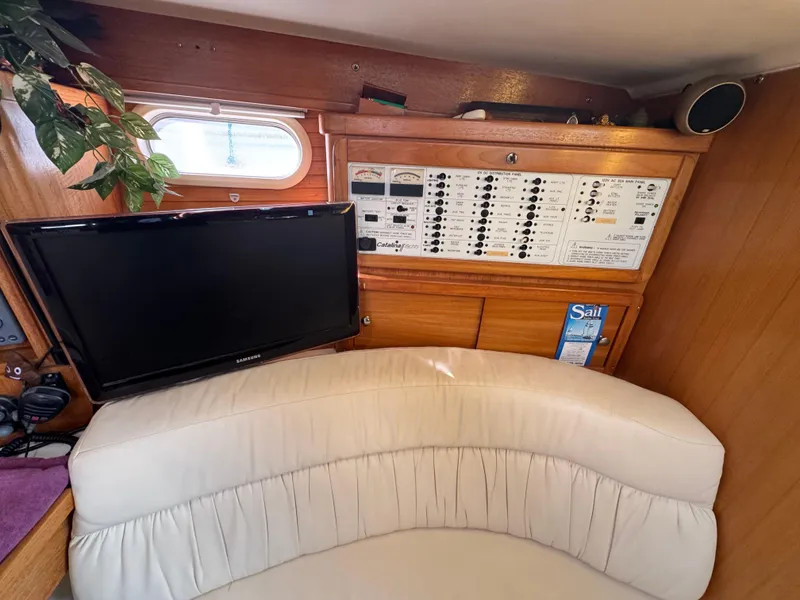 Slide: The Image of Interior of 2001 Catalina 42 MK II yacht with control panel and seating area. - 22