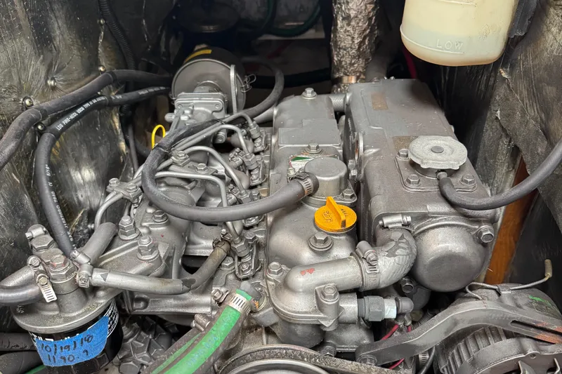 Slide: The Image of Engine of a 2001 Catalina 42 MK II sailboat, showcasing intricate mechanical components. - 30