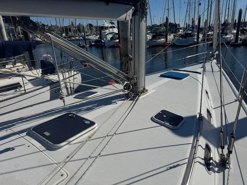 Slide: The Image of Deck view of a 2001 Catalina 42 MK II sailboat docked in a marina. - 7