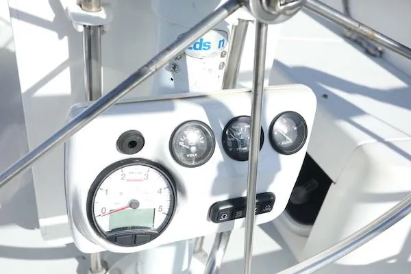 Slide: The Image of Control panel of a 2000 Catalina 320 sailboat with gauges and switches. - 15