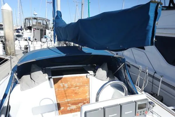 Slide: The Image of Sailboat Catalina 320, 2000 model, docked at marina with blue sail cover. - 20