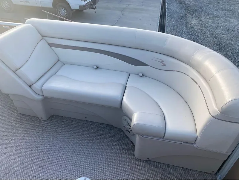 Slide: The Image of 2016 Bennington 22 SSX Elliptical Toon Package boat seating, featuring plush white upholstery. - 4