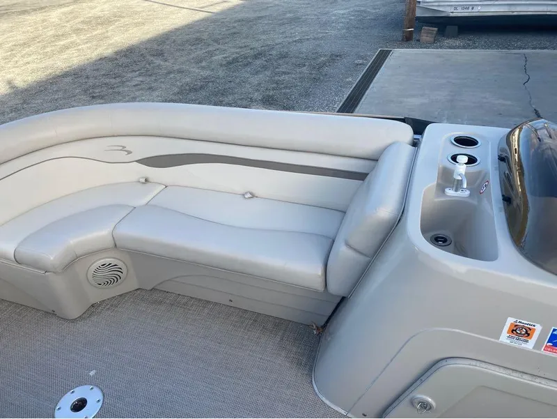 Slide: The Image of 2016 Bennington 22 SSX Elliptical Toon Package interior with gray seating and console. - 6