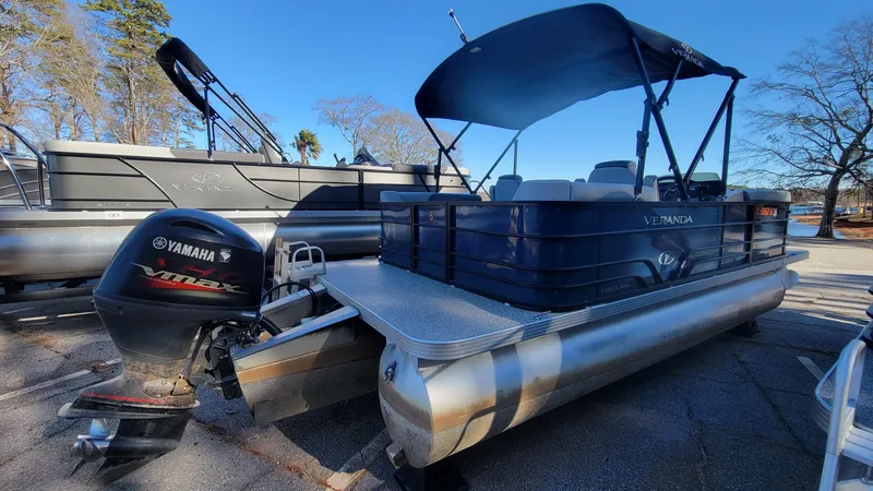 Slide: The Image of 2023 Veranda Vista 20 RC pontoon boat with Yamaha VMAX engine, parked outdoors. - 3