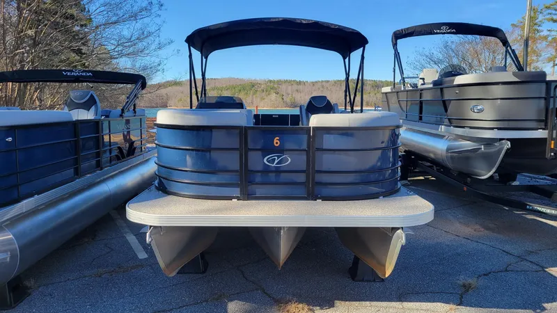 Slide: The Image of 2023 Veranda Vista 20 RC pontoon boat displayed outdoors. - 4