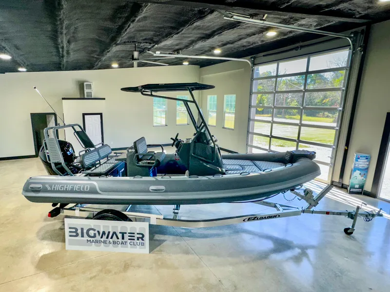 Slide: The Image of 2025 Highfield Sport 560 boat displayed indoors at Bigwater Marine & Boat Club. - 0